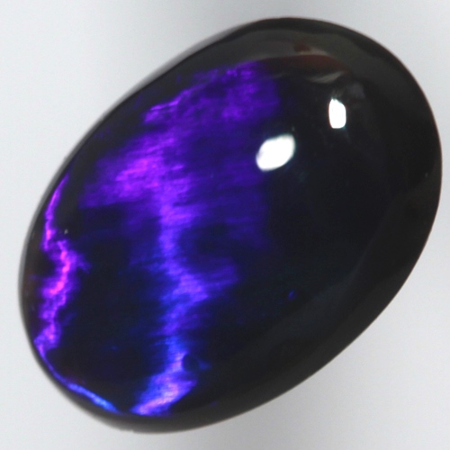 SOLID BLACK OPAL Bright electric blue. Broad rolling flash